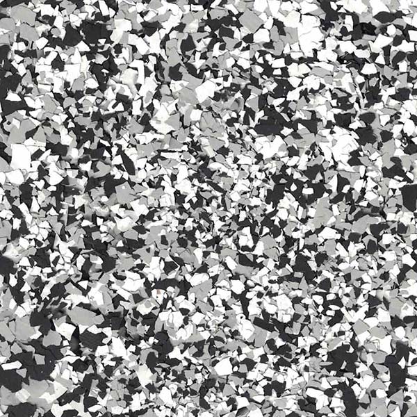 The image is a monochrome, abstract pattern consisting of many irregular shapes in varying shades of gray, resembling a fragmented, textured surface.