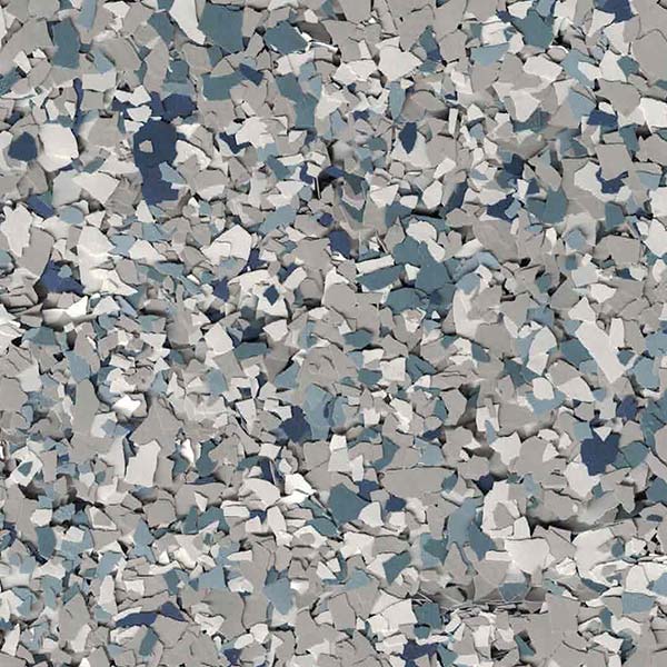 The image is a close-up of numerous small, irregularly-shaped pieces in varying shades of gray, blue, and white, resembling a textured, fragmented surface.