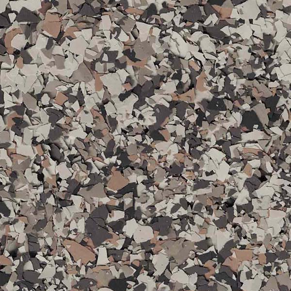 The image shows a close-up of a textured surface with a mottled pattern of various shades of brown, gray, and white, resembling stone or camouflage.