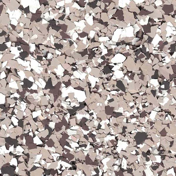 The image displays a chaotic arrangement of jagged, abstract shapes in varied shades of brown, gray, black, and white, creating a textured, speckled pattern.