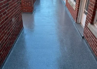 A Grey patio floor coating done professionally by Higgins Coatings